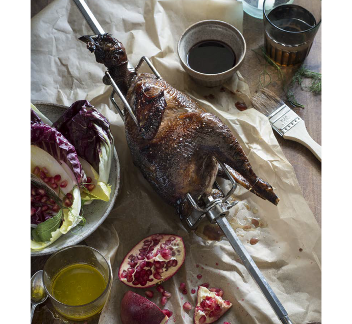 Spit-roasted Vicenza guinea fowl with pomegranate and wild herb misticanza salad